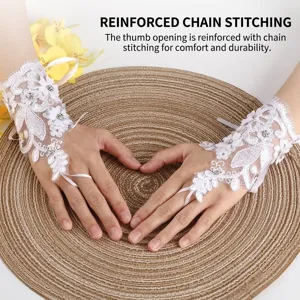 Elegant white lace bridal fingerless gloves with rhinestones and ribbon ties for wedding