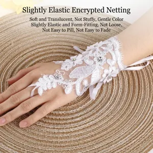 Elegant white lace bridal gloves featuring 3D flowers and sparkling rhinestones decoration.