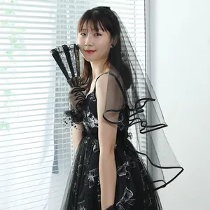 Elegant black double-layered bridal veil with ribbon edge for vintage wedding or Halloween.