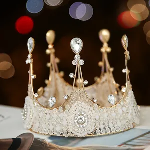 Detailed macro view of a handmade white lace and crystal bridal crown for weddings