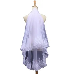 Elegant two-layer white bridal veil with delicate lace edges and subtle sequins