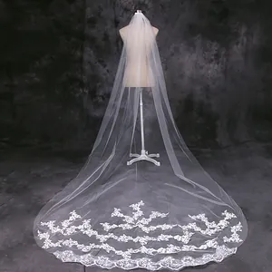 Exquisite long bridal veil featuring intricate lace embroidery details on white mesh