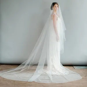Full view of a 3m long white double layer bridal veil showing elegant draping and length.