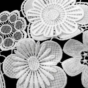 Macro detail of white milk silk double-layer flower embroidery lace appliqué for DIY