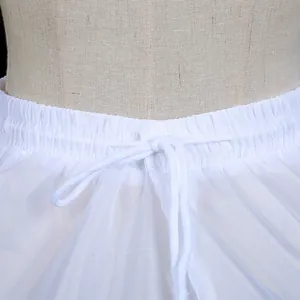 Close-up detail of the elastic waistband and white drawstring on a bridal hoop skirt