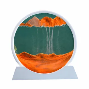 Dekorative 3D-Fließsandlampe mit orangefarbenem Berglandschaftsdesign im Rahmen.