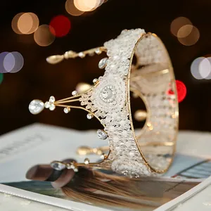 Close-up detail of an elegant handmade lace beaded queen crown with sparkling crystals