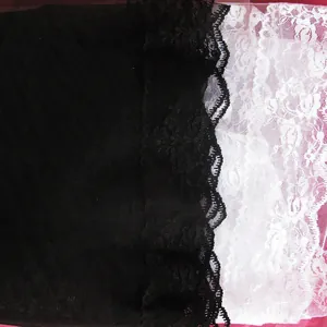 Detailed close-up showing vintage black and white floral lace textures for a stage veil