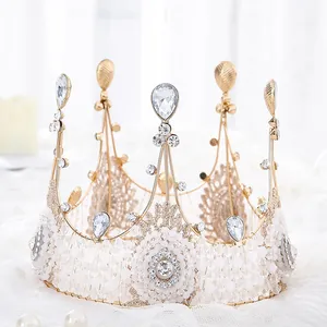 Detail of handmade lace beaded queen crown with elegant crystals for wedding hair