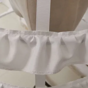 White Lolita birdcage petticoat with ruffled hem details and straps.