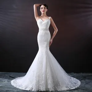 Full view of elegant mermaid wedding dress with intricate lace embroidery and fitted bodice