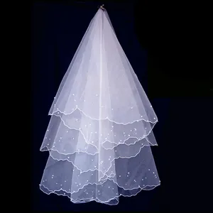 White multi-layer bridal veil with scallop edges and delicate pearl embellishments.