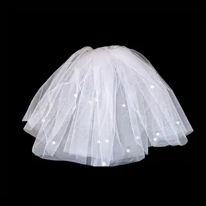Elegant white double layer short bridal veil featuring delicate pearl embellishments and hair comb