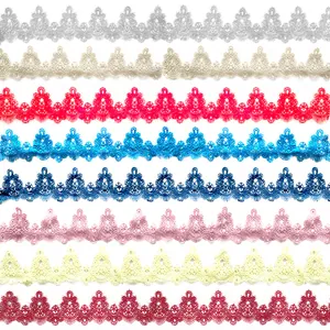 Detail of various colored water-soluble lace trims with intricate hollow embroidery