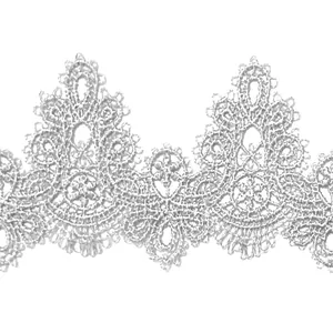 Detailed view of white water-soluble lace trim with intricate hollowed embroidery