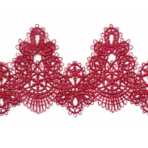 Detailed view of red water-soluble lace trim with intricate embroidery DIY accessory