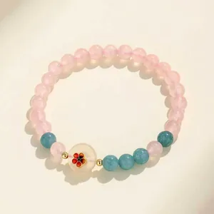 Elegante braccialetto in quarzo rosa e agata blu fatto a mano con ciondolo in giada floreale