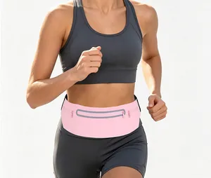 Close-up detail of a pink waterproof sports waist bag with a reflective strip for running