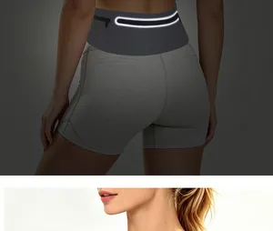 Detail showing slim running waist bag with high-visibility reflective strip worn on waist