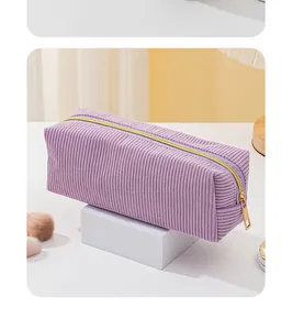 Pochette trucco in velluto a coste viola, capiente borsa da viaggio con cerniera.