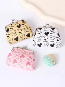 Lot de trois mini porte-monnaie mignons à imprimé cœur en rose, blanc et jaune.