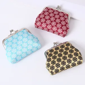 Set of three mini retro kiss-lock coin purses with geometric circular patterns
