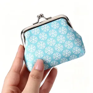 Mini retro light blue coin purse with geometric patterns and metal clasp closure