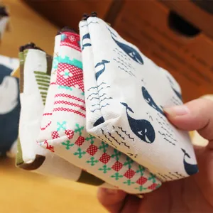 Detailed view of vintage cotton linen coin purses with whale and geometric prints