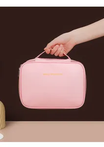Portable pink waterproof large-capacity cosmetic storage bag for travel with gold text