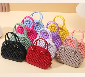 Close-up of vibrant mini PVC jelly shell bags featuring beaded texture and gold hardware details