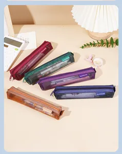 Detailed view of colorful retro mesh pencil cases for students and stationary storage