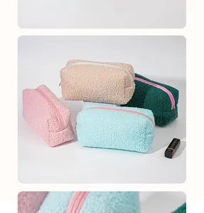 Detailed view of four colorful lamb fleece plush cosmetic storage bags with soft texture
