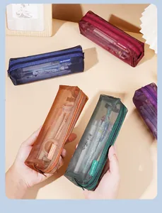 Detailed view of various colorful vintage mesh pencil cases for stationery organization