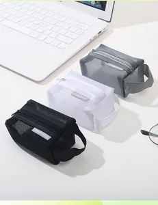 Detailed view of three nylon mesh storage bags in black, white, and grey with zippers.