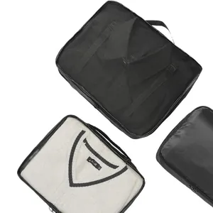 Professional black mesh travel packing cubes for clothing organization on white background
