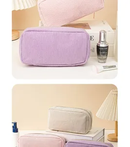 Detailed view of various corduroy cosmetic bags in pastel colors with large capacity