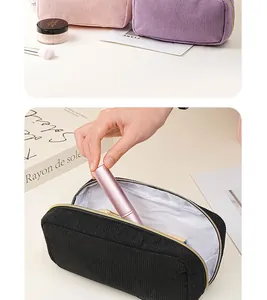 Large capacity corduroy makeup bag detail showing soft ribbed texture and internal storage