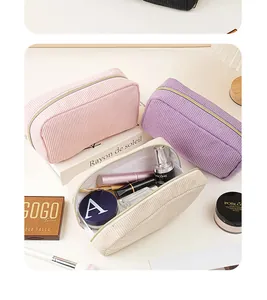 Detailed view showing the corduroy texture and spacious interior of the makeup bags