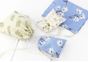 Detail showing various patterns and textures of cotton linen drawstring pouches