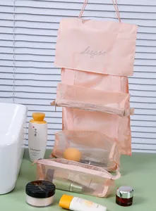 Close-up detail of the 4-in-1 detachable pink mesh hanging makeup organizer with cosmetics