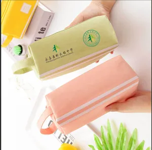 Detailed view of large capacity canvas pencil pouch with custom school logo print