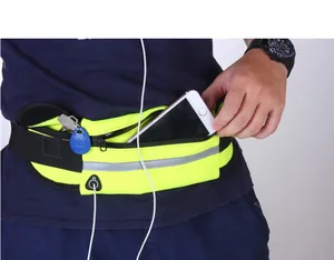 Close-up of a neon yellow running waist bag showing a phone being inserted