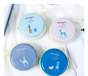 Four assorted round tinplate coin purses with cute cartoon animal prints and slogans
