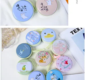Assorted mini tinplate coin purses with cute cartoon animal and fruit patterns