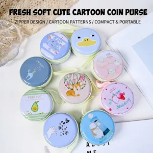 Collection of colorful round tin coin purses featuring various cute cartoon animal prints