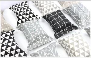 Collection of cotton linen tissue box covers with geometric patterns on a white background