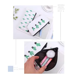 Detailed view of white canvas pencil case with cute green cactus pattern and interior storage
