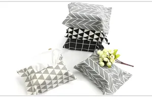 Detail view of cotton linen tissue box covers featuring modern geometric patterns