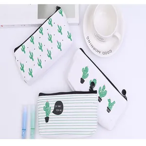 Detailed view of multiple canvas cactus pencil cases with various cute designs and patterns