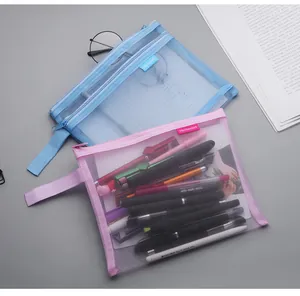 Detail view of A5 transparent mesh document pouches in blue and pink with stationery